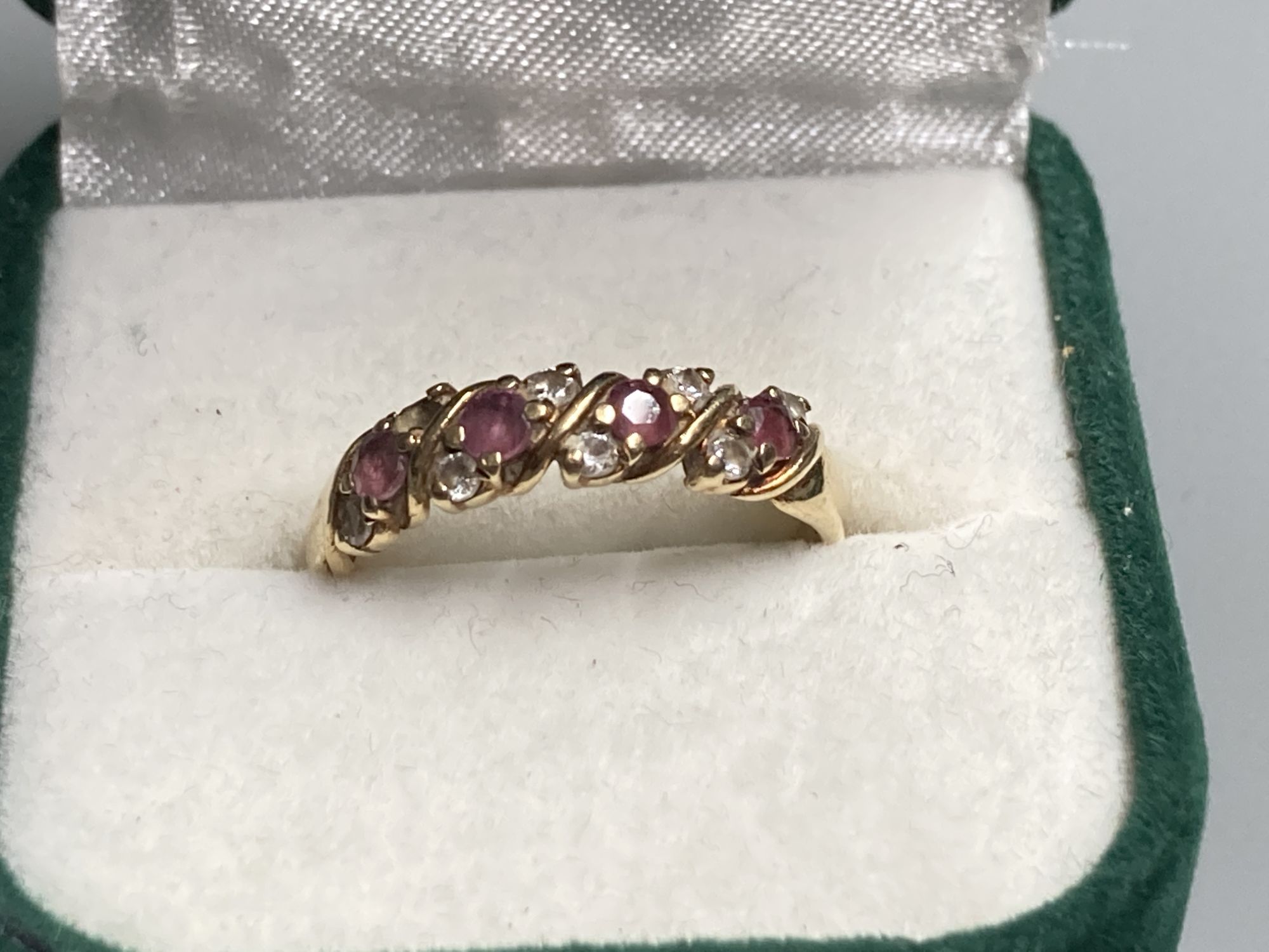 Three assorted modern 9ct gold or 9k gem set dress rings